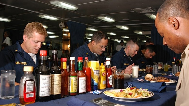 Navy crew praying before meal