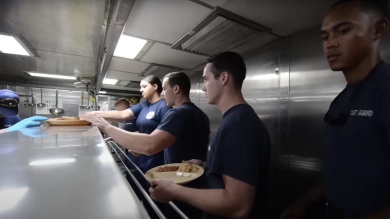 Sailors grabbing food