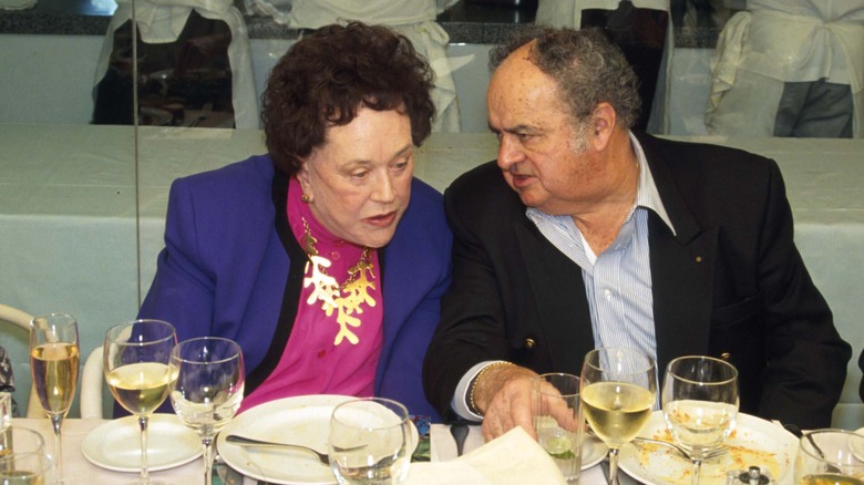 Julia Child at a table with full place settings