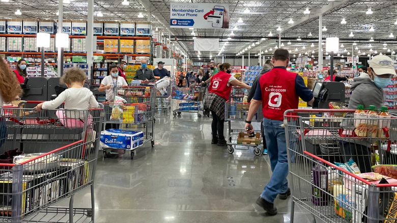 Costco employees helping customers