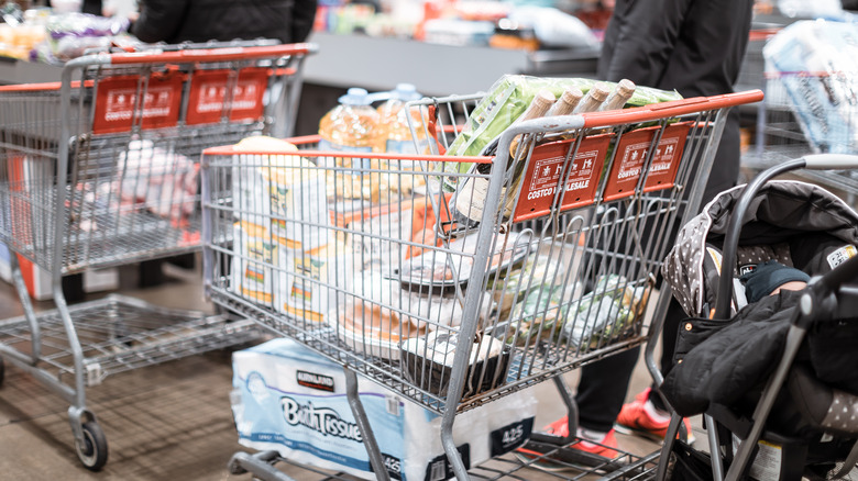 Person with cart at Costco checkout