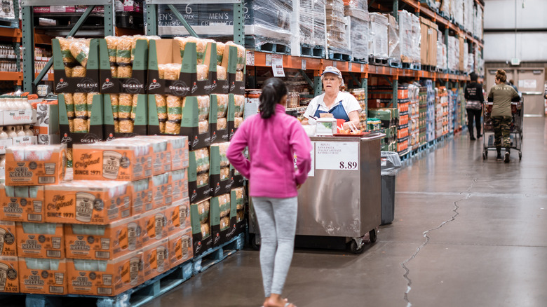 Costco customer and sample worker chatting