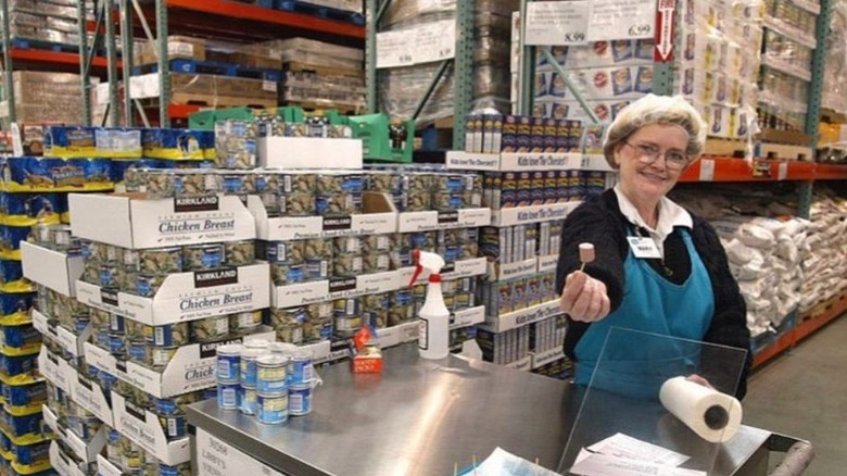 woman serving costco sample