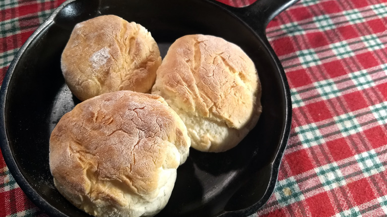 three biscuits in a cast iron pan