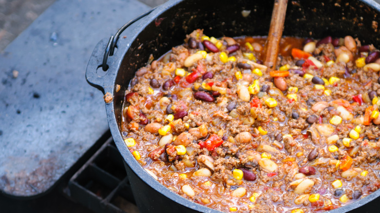 chili cooking over a fire