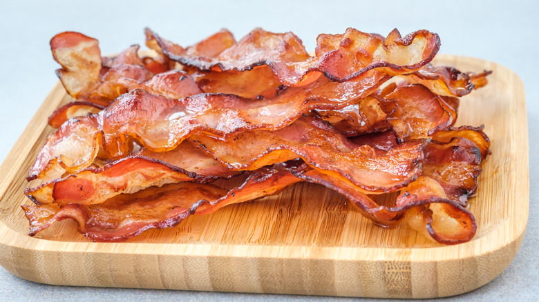 platter of bacon on wooden board