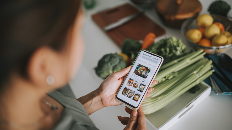 Woman looking at a grocery app