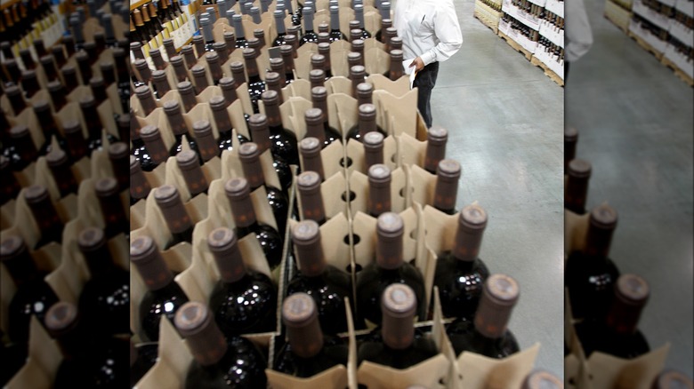 Wine bottles lined up in warehouse