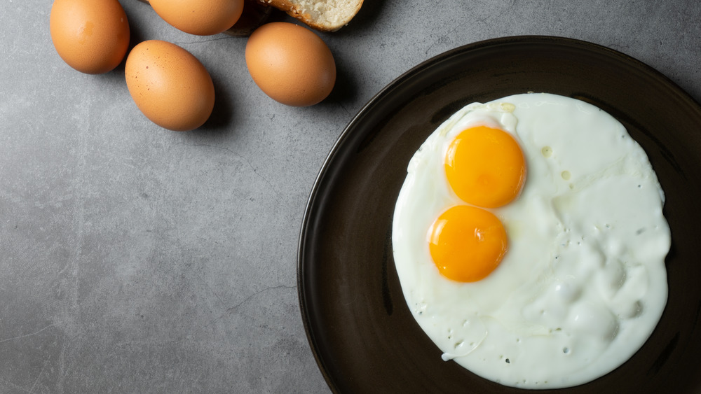 Double yolk fried egg in a pan