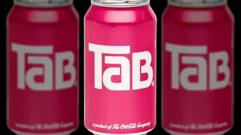 Tab soda cans on background