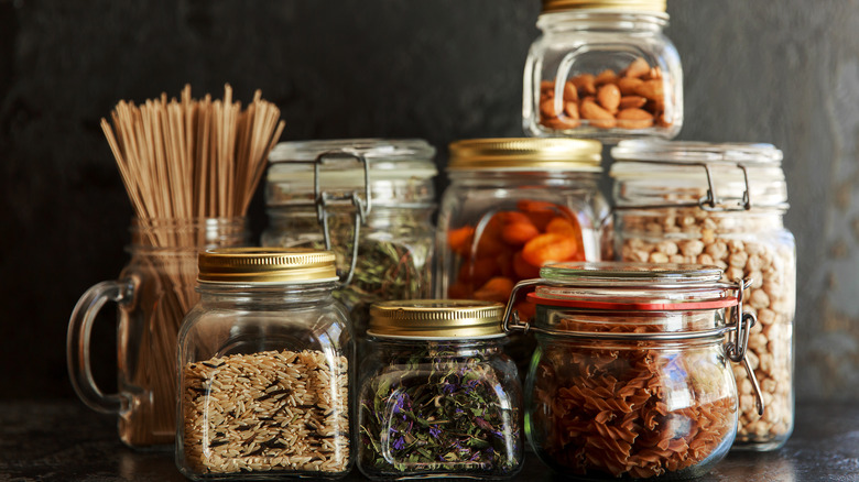 grains and pastas in glass jars in a pantry