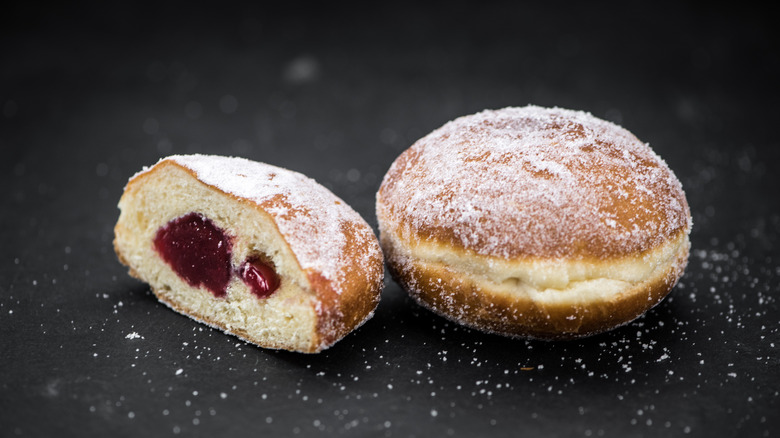 Full berliner and split open berliner with jelly