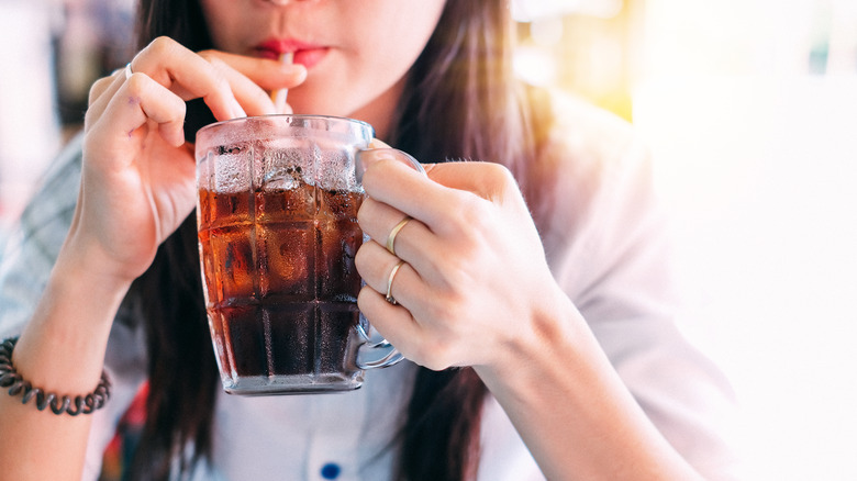 drinking soda from straw