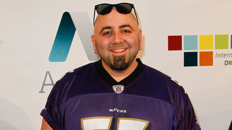 Duff Goldman wears a Ray Lewis jersey and sunglasses on head