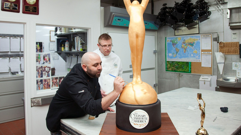 Duff Goldman fixing cake