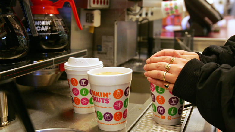 Dunkin' employee preparing orders