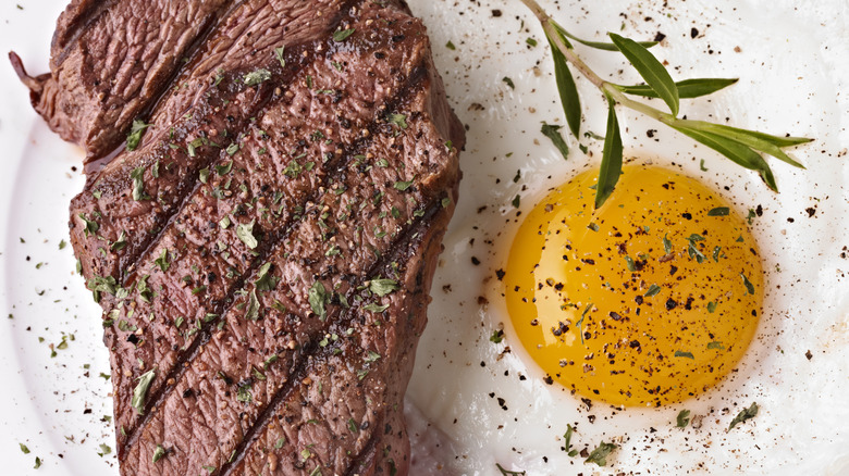 Steak and egg with herbs