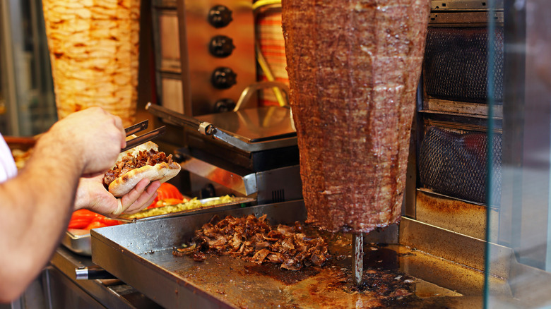 Person preparing döner kebab