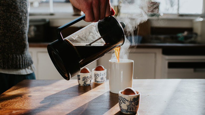 Person pouring coffee