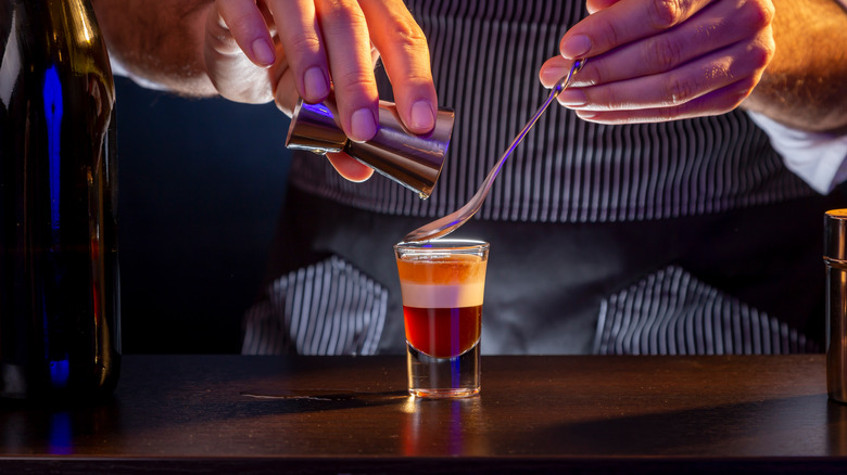 bartender pouring B-52 shot