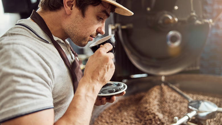 Coffee roaster sniffing coffee