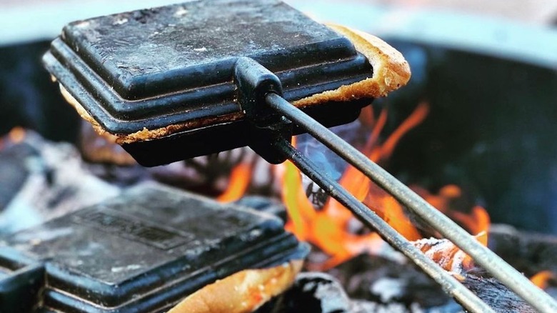 Pudgy pie cooking over fire