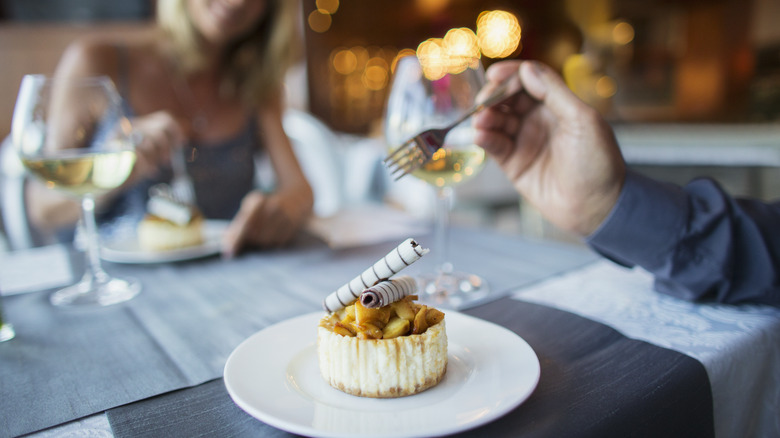 Man eating gourmet tiny dessert