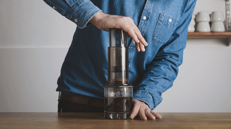 Man using an AeroPress