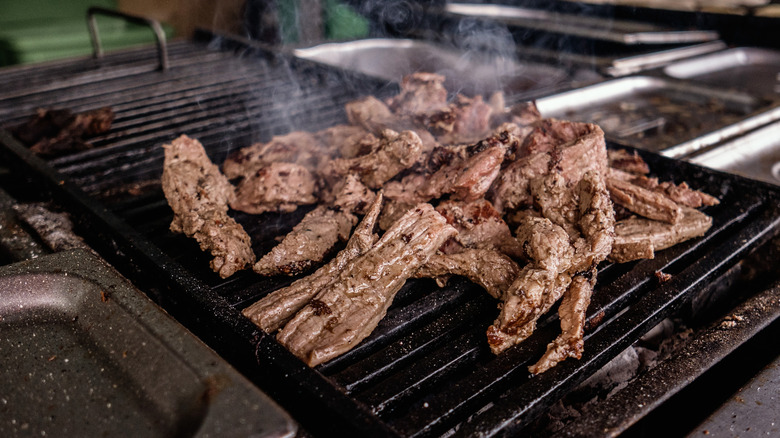 cooked steak on grill