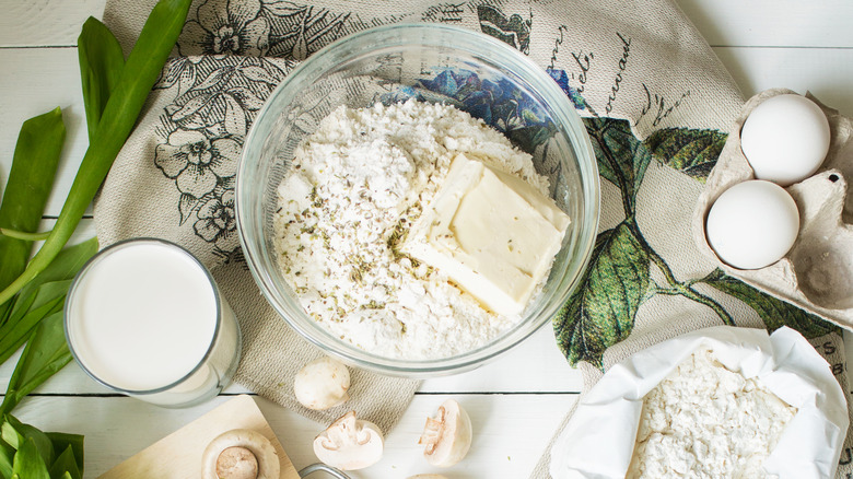 cream, eggs, and flour on counter