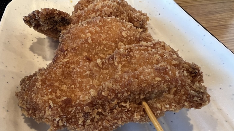 Skewered chicken katsu in plate