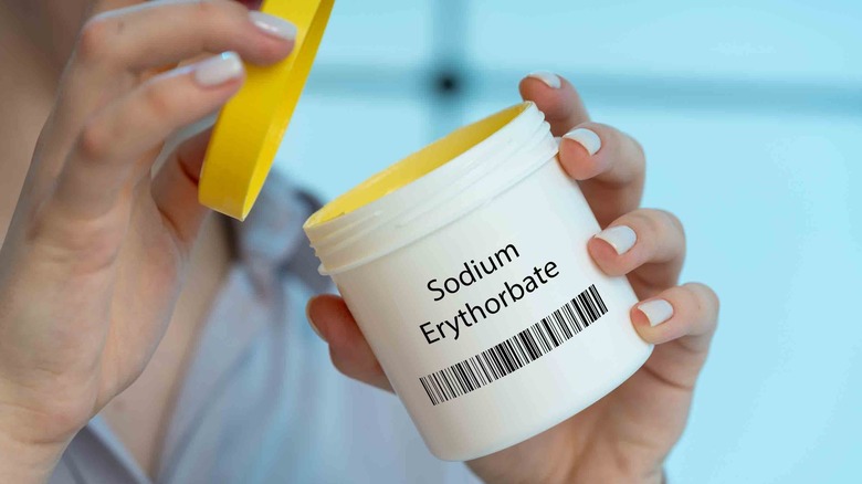 Opening bottle of sodium erythorbate