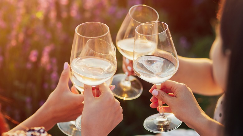 People toasting with wine