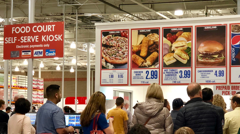 Costco food court signage showing the no longer available cheeseburger