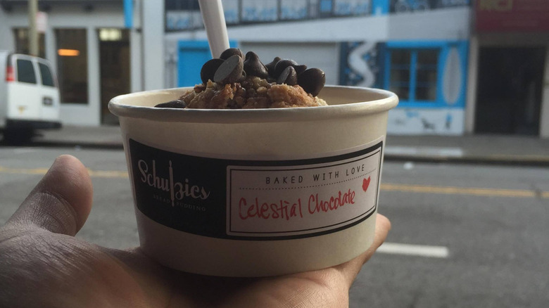 Hand holding cup of Schulzies chocolate bread pudding