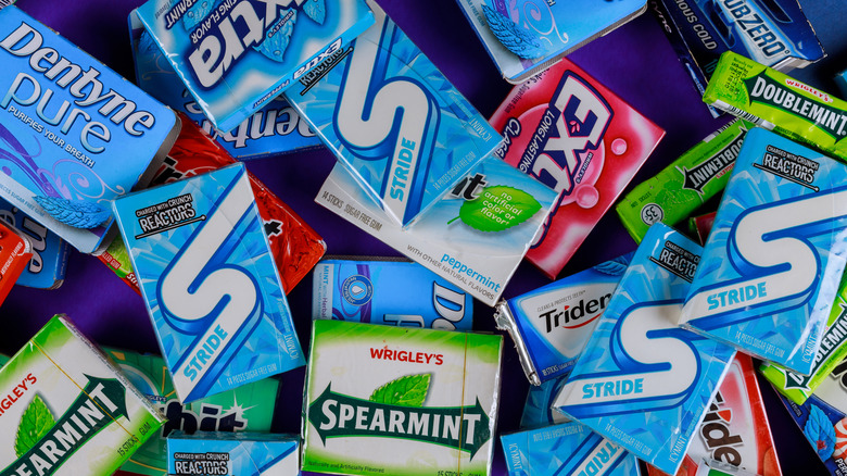 packs of various gum brands, including Stride, in a pile