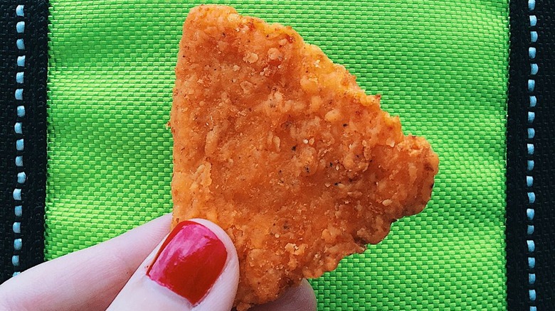 Person holding a Naked Chicken Chip