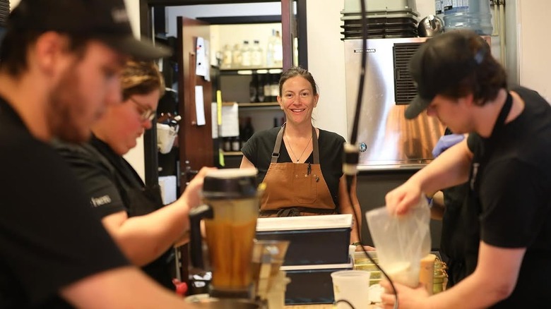 Sara Bradley in brown apron