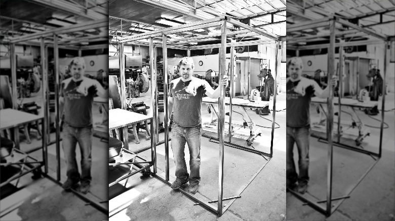 Chef Ben building a cooking shed