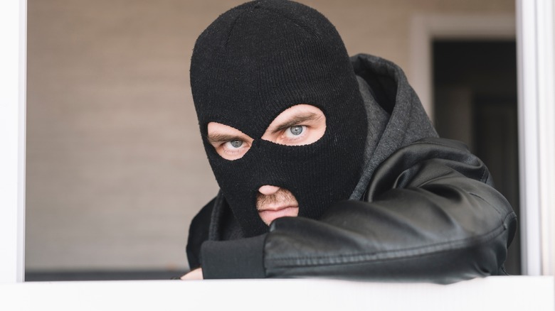 masked robber at window