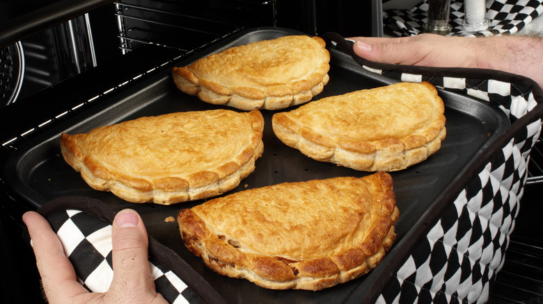 A tray of baked Cornish pasties