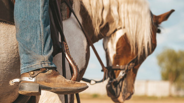 cowboy with spurs on boots