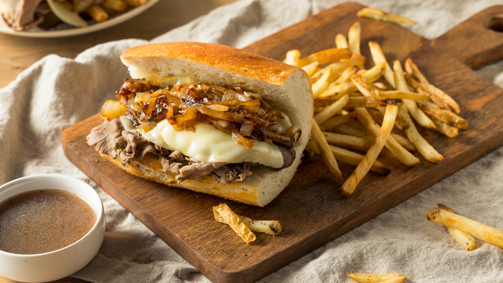 French dip sandwich on cutting board 