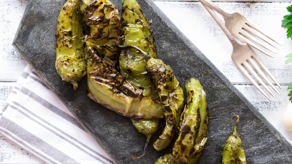 roasted Hatch green chiles on a serving platter 