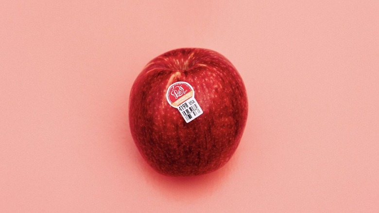 Lucy Apple on pink background