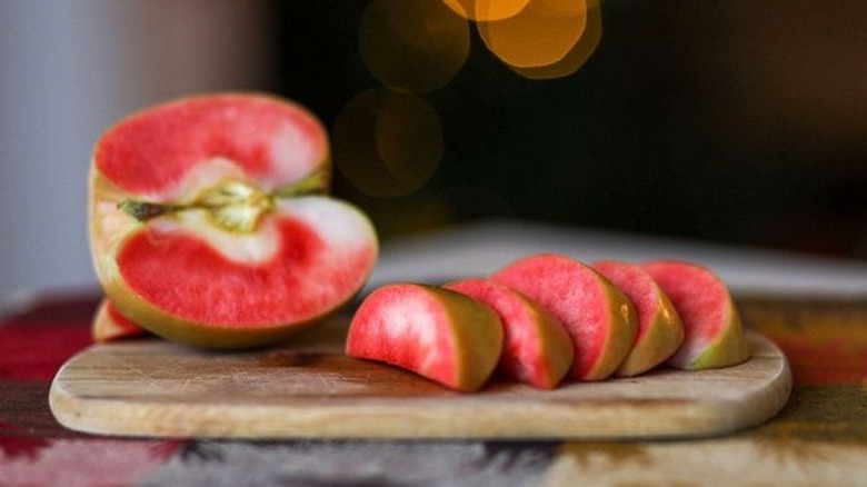 A sliced Lucy Glo Apple