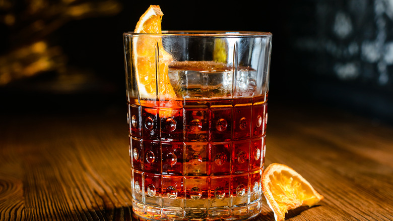 Negroni in glass with orange wedges