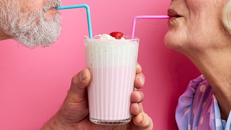 Couple drinking a Pink Squirrel