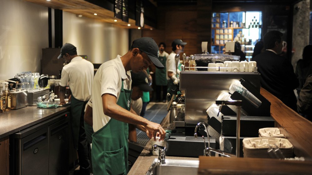 Starbucks barista preparing drink