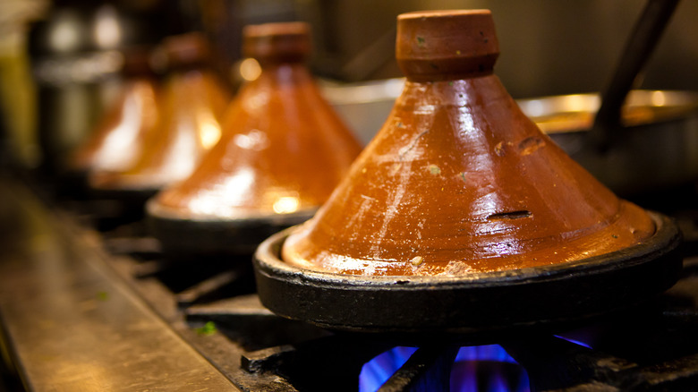 Brown clay tagines on stovetop